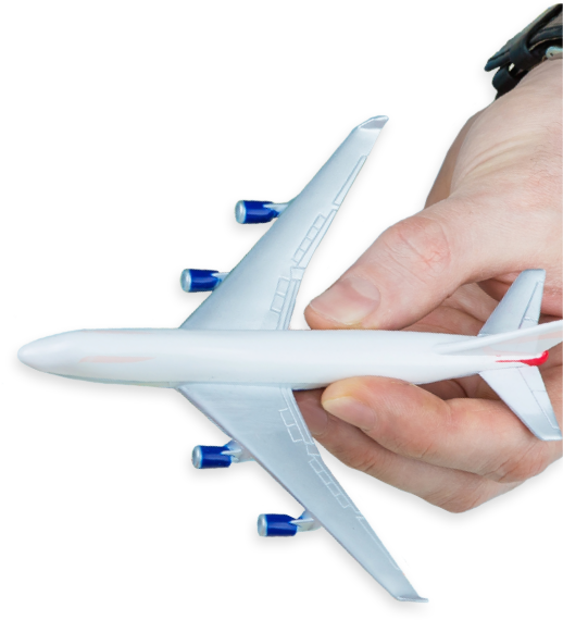 photo of a hand holding a toy airplane